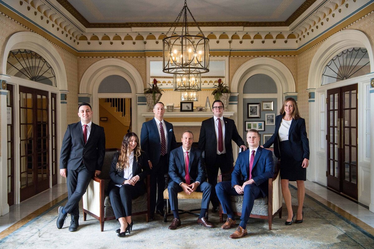 A team photos of executives taken at a La Joll Hotel Lobby