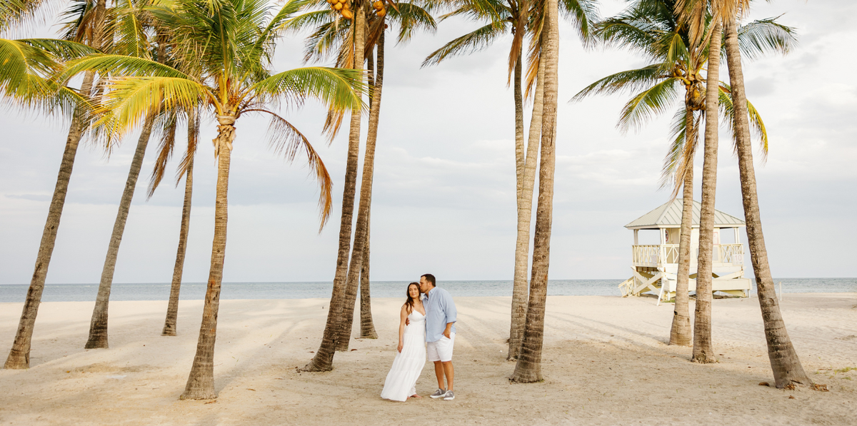 Couple enjoying a romantic moment on a beach in South Florida, captured by Claudia Amalia Photography. Wedding photographer in Miami and Florida Keys, specializing in destination weddings and lifestyle photography.