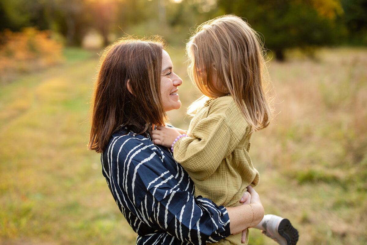 Mom and daughter share a moment during lifestyle family photos