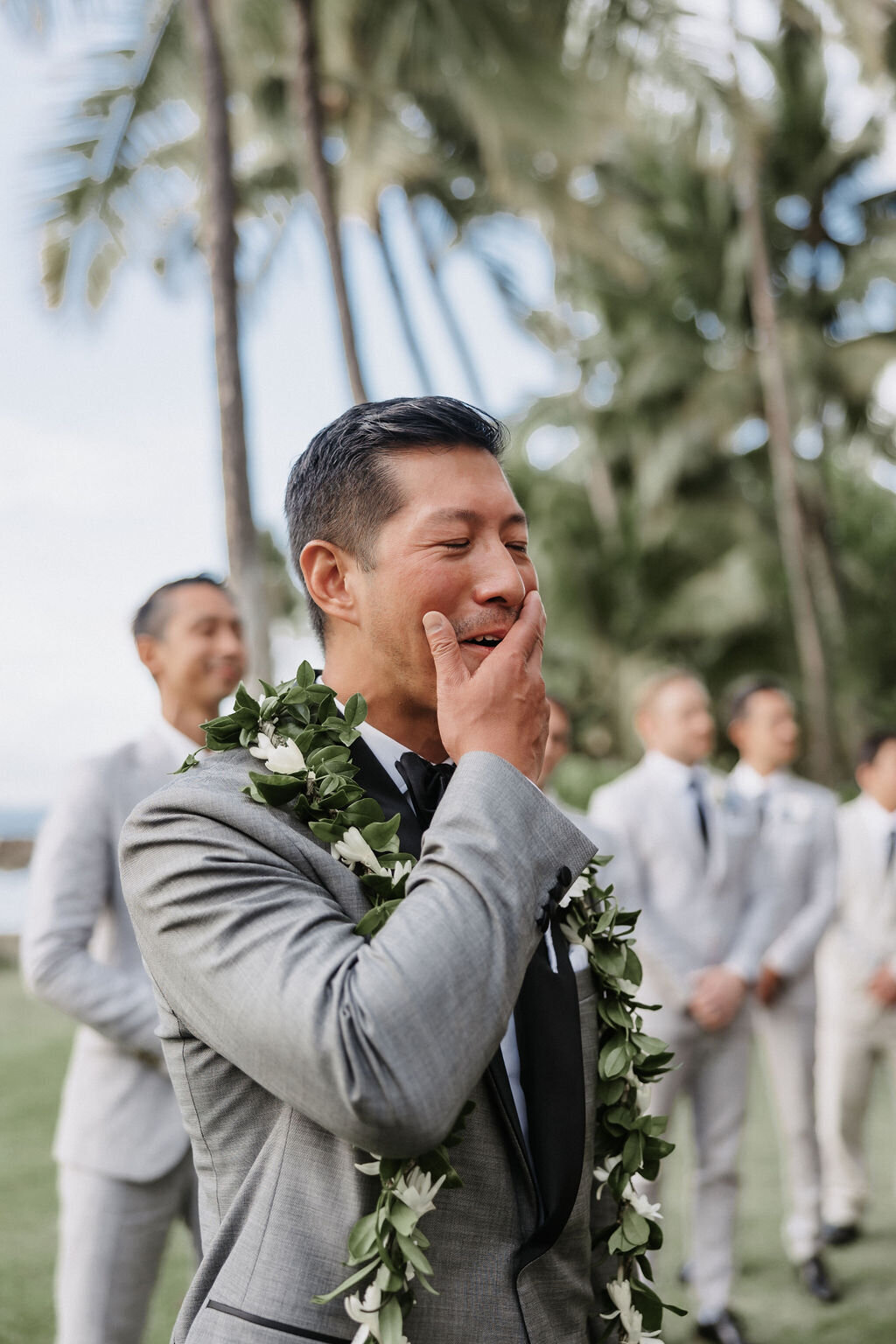 grooms reaction crying seeing bride walk down the aisle at wedding ceremony