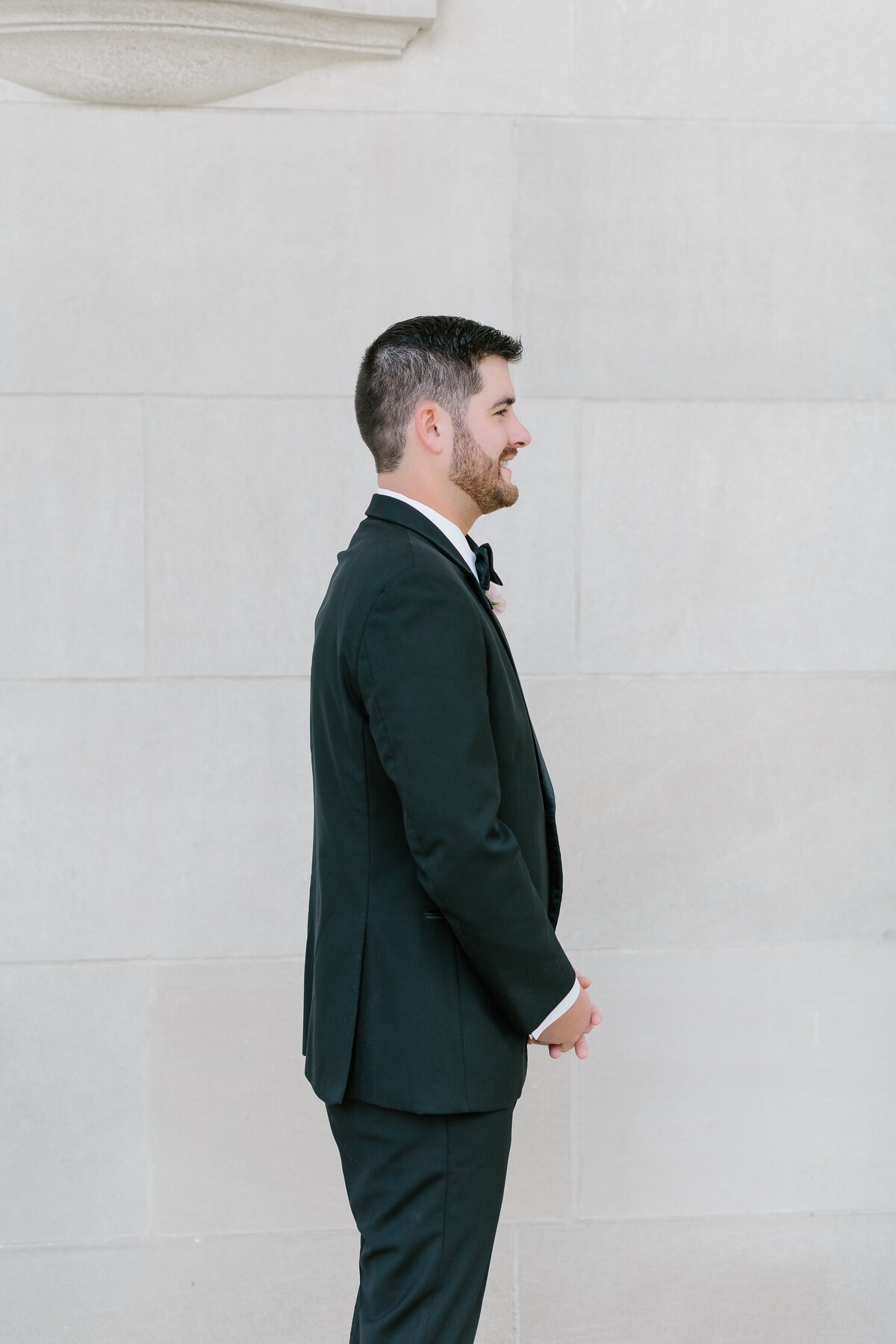 Groom waiting for first look