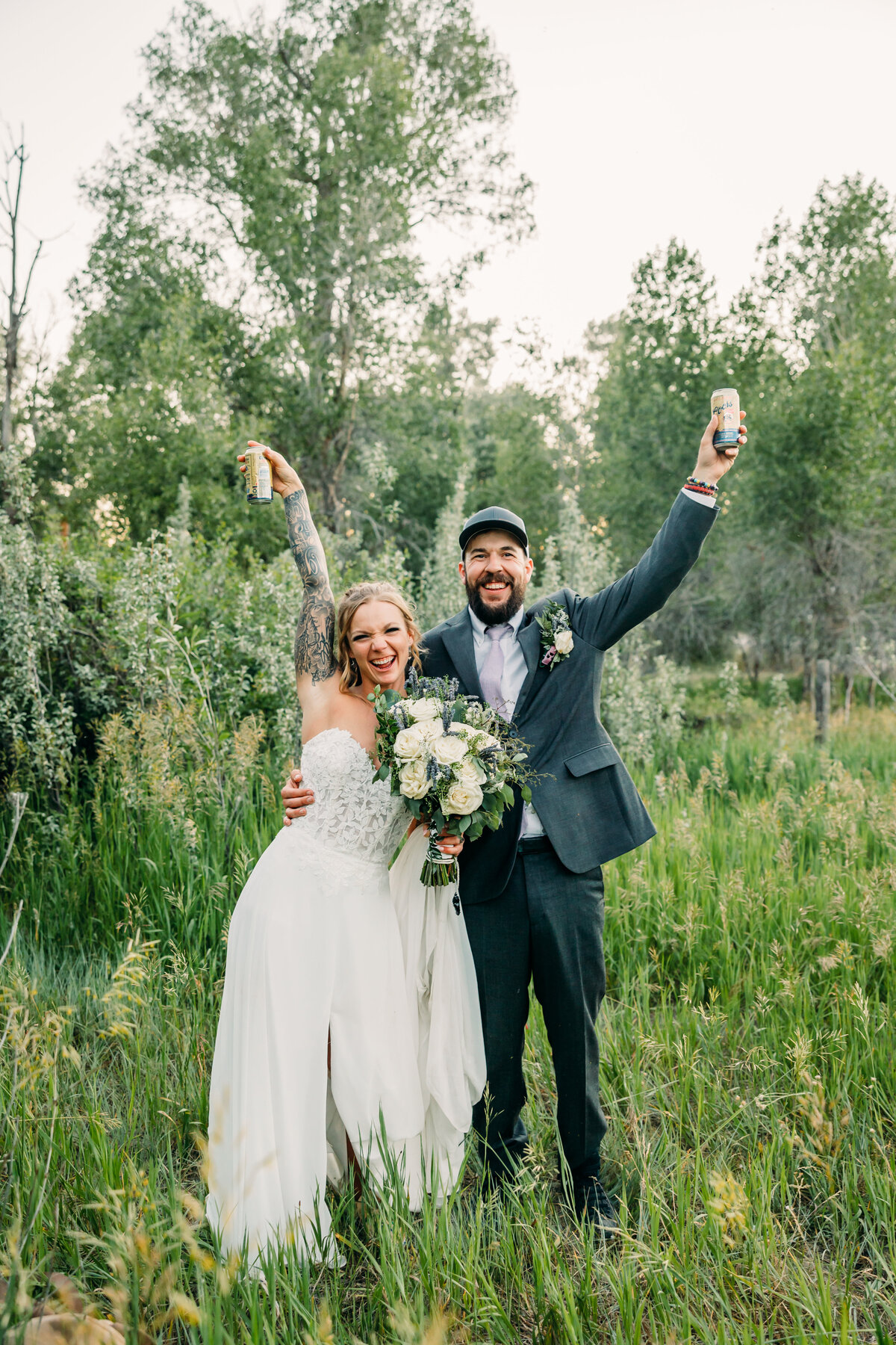 couple toasting each other after getting married in Jackson Hole Wyoming and Grand Teton National Park 
