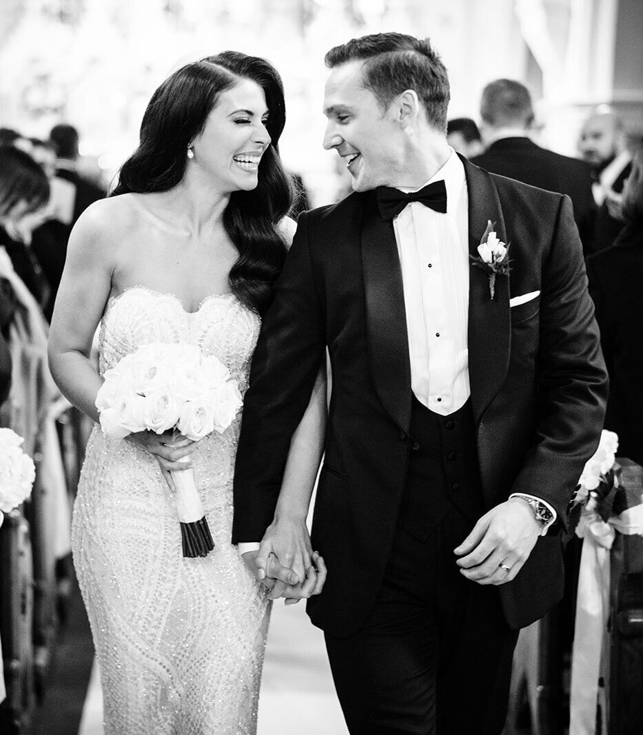 bride and groom just married walking down the aisle after their church wedding ceremony