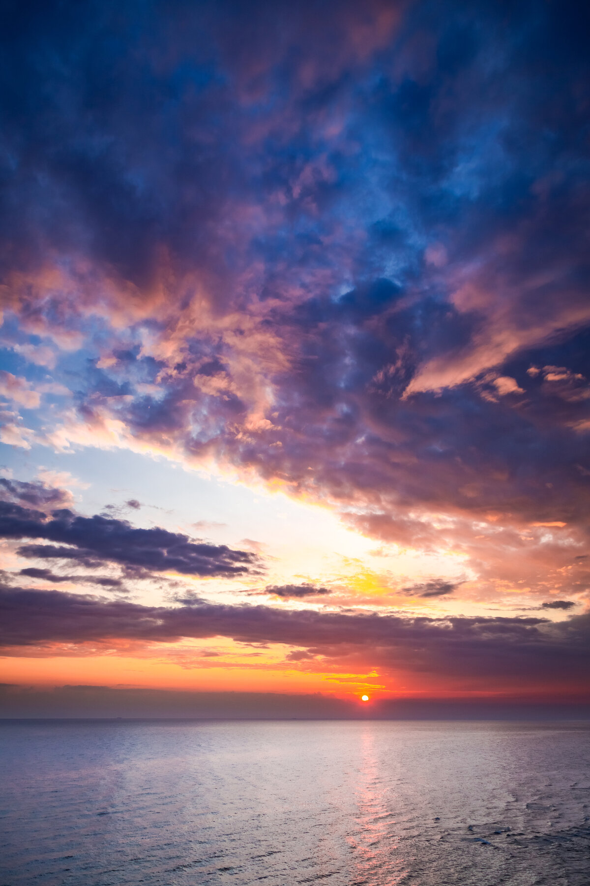 wonderful-dusk-over-calm-ocean-in-summer-with-sun-2023-11-27-05-33-03-utc