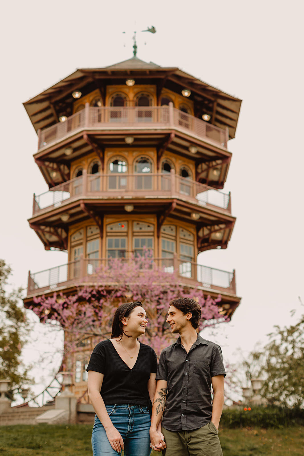 A couple standing in front of a Japanese style building 