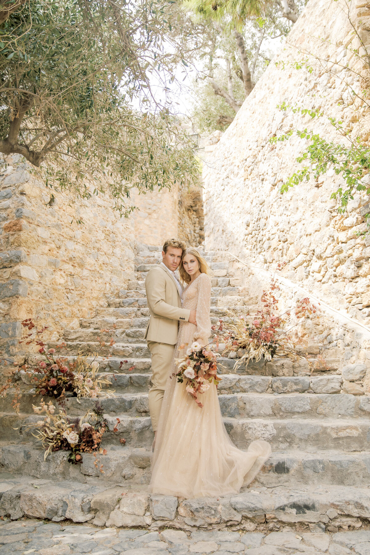 Groom spins his bride outdoors on their wedding day