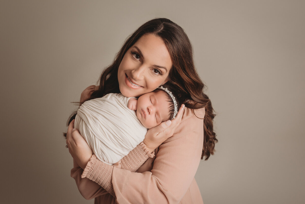 Portrait of mom and newborn baby girl with Atlanta newborn photographer Casey McMinn Photography