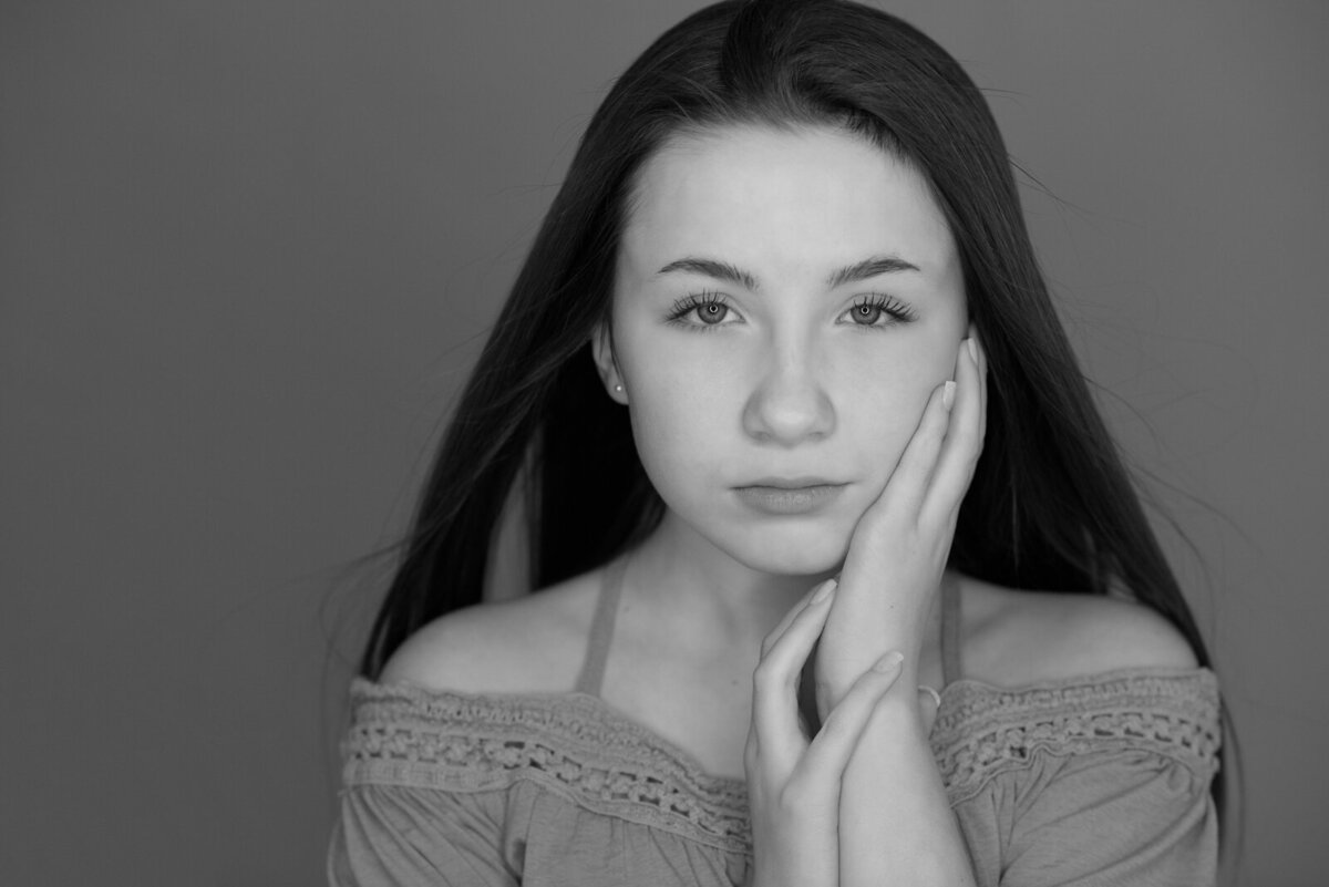 Tween girl looking stoic in photo studio in Boise.