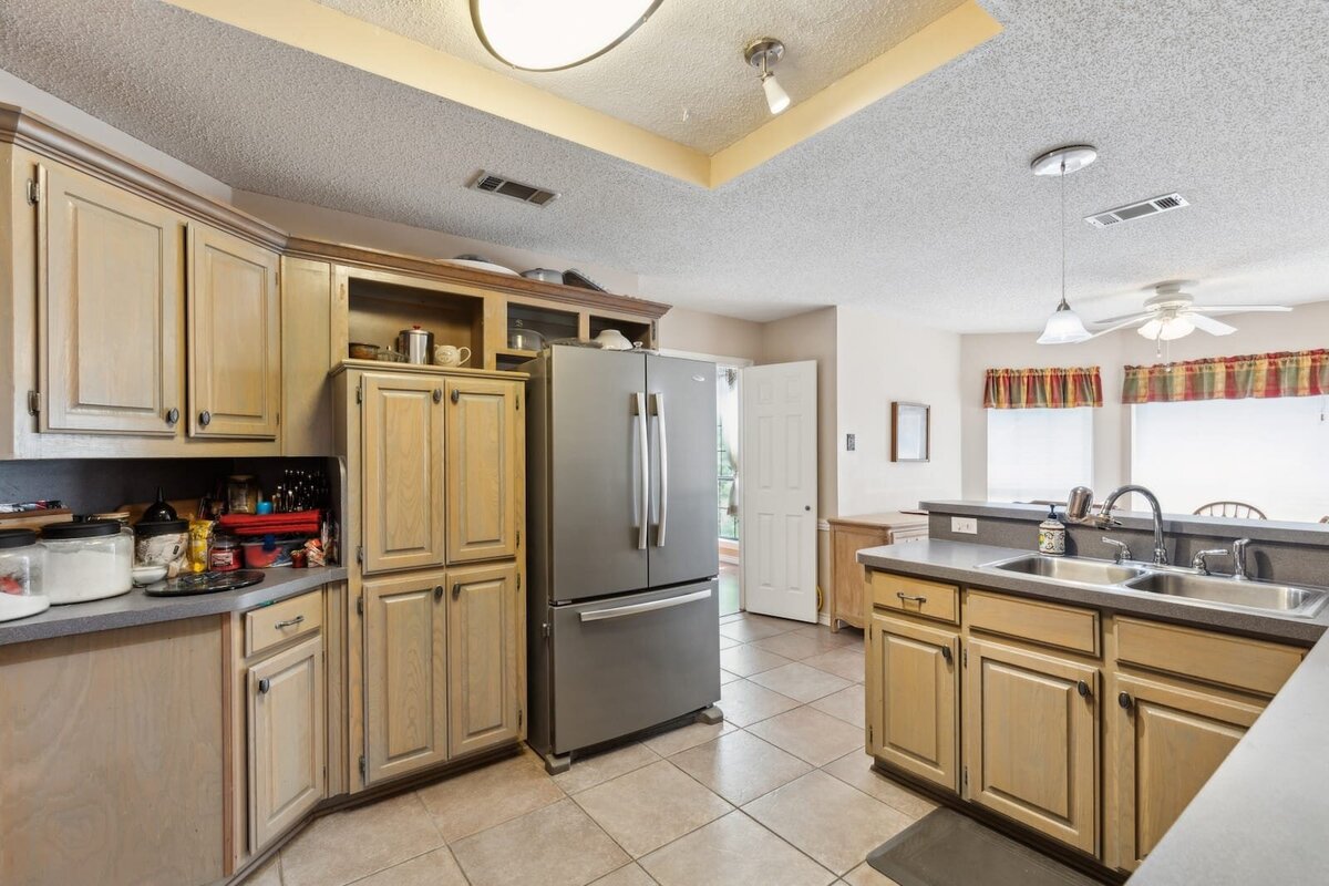 6419_shadow_lane_dallas_tx_kitchen_with_pantry_and_fridge_view_-_functional_layout_and_storage_-_haven_realty_group