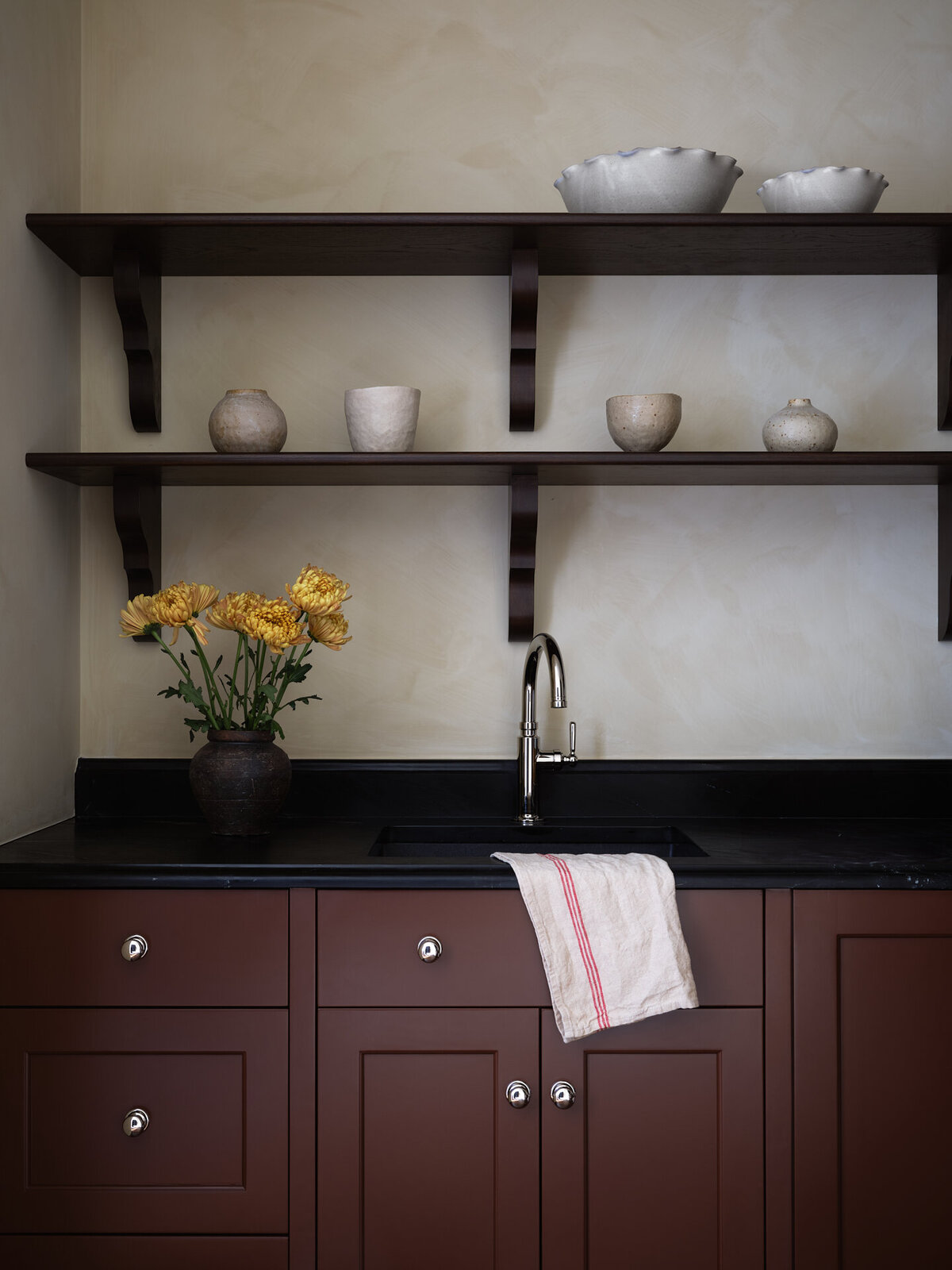 house-franc-hillside-hideaway-bathroom-remodel-renovation-jamie-sigler-home-burgundy-kitchen-soapstone-countertops-walnut-floating-shelves-limewash-walls-pears-vintage-painting-moody-interiors-austin-texas