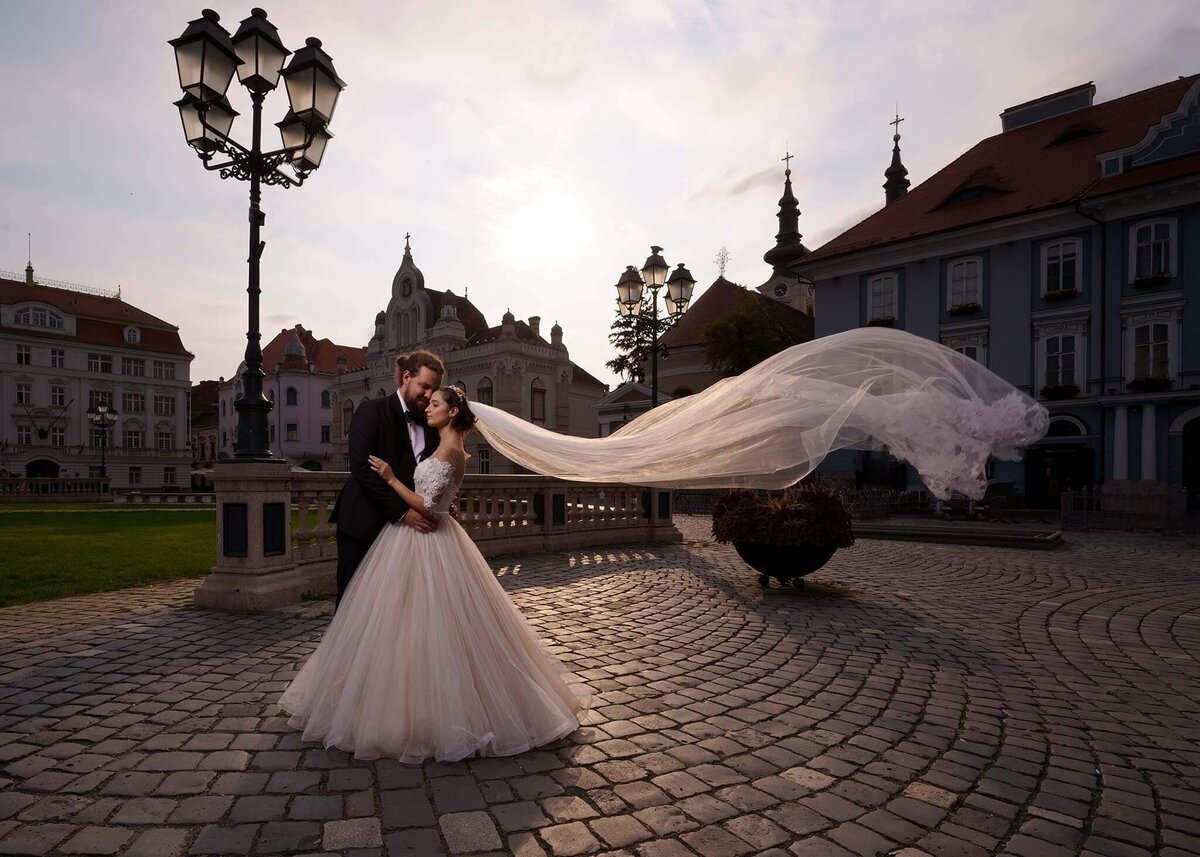 Groom and Bride hugging at the sunset.