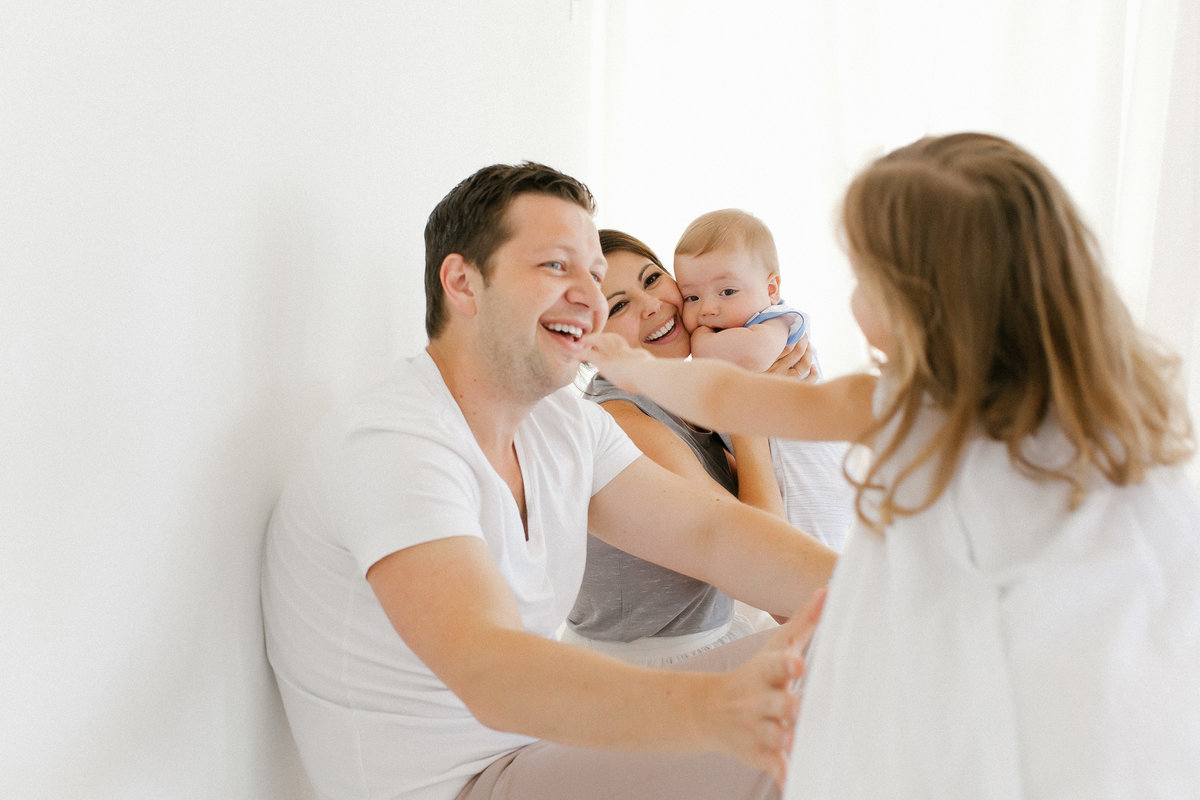 Family of four playing during studio session