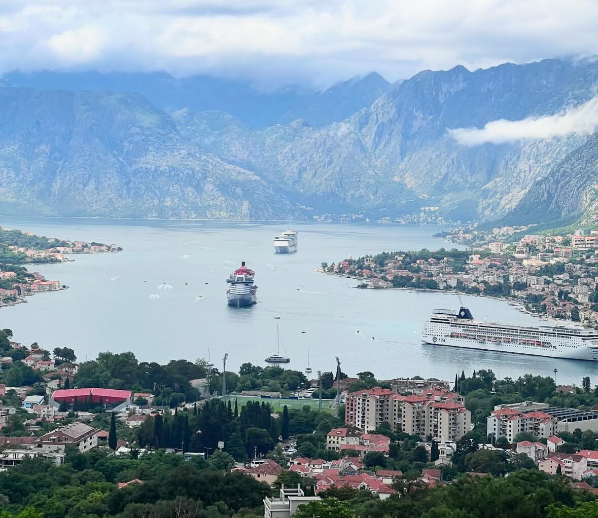 Cruise ships in European Sea with Mountains