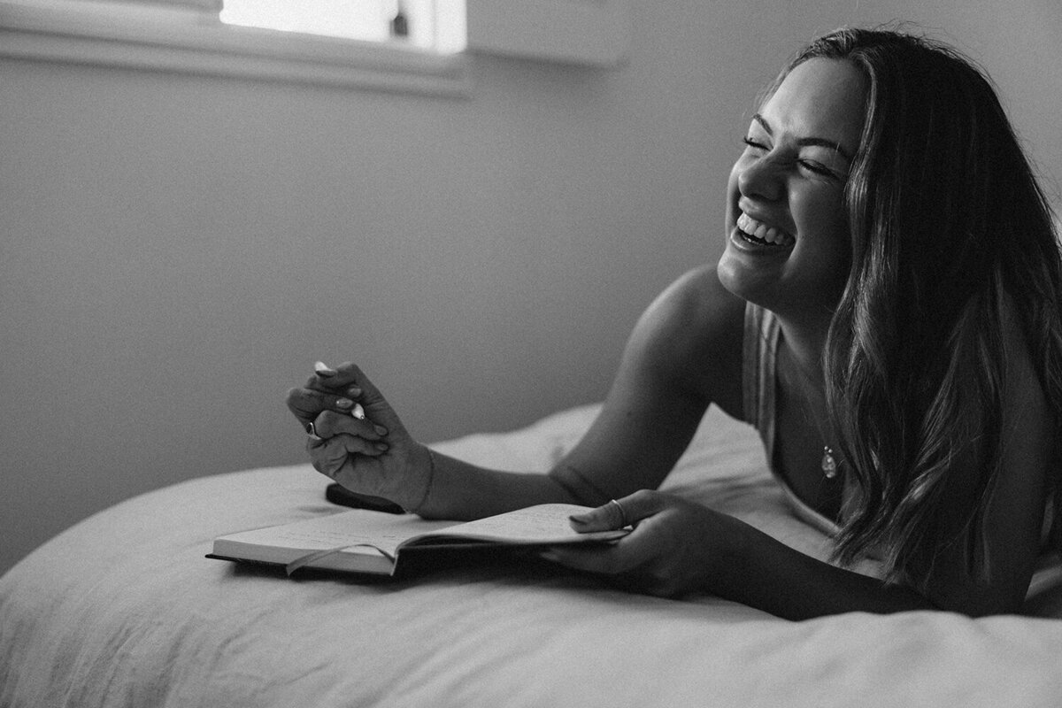 Personal branding photo of a woman journaling, styled by Sunshine Coast branding photographer for reflective brands.