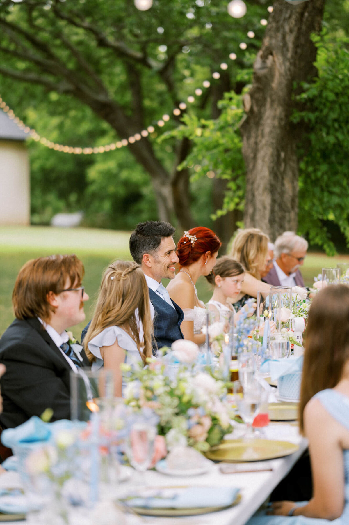 wedding-guests-smiling-during-dinner