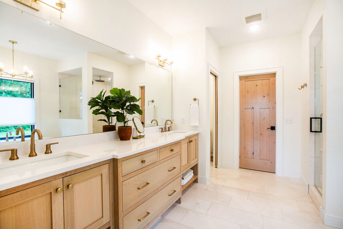 Custom bathroom with soaking tub, double vanity, and walk-in shower in Otsego custom home