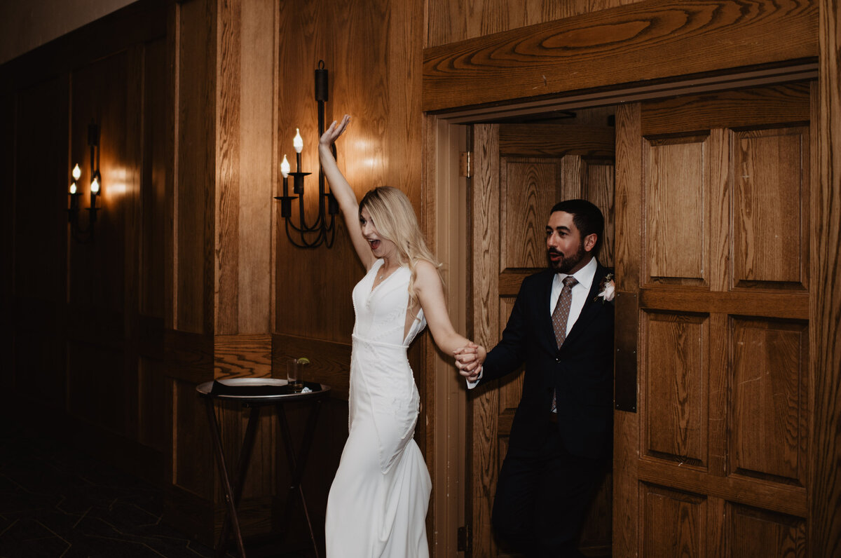 Photographers Jackson Hole capture bride and groom entering reception