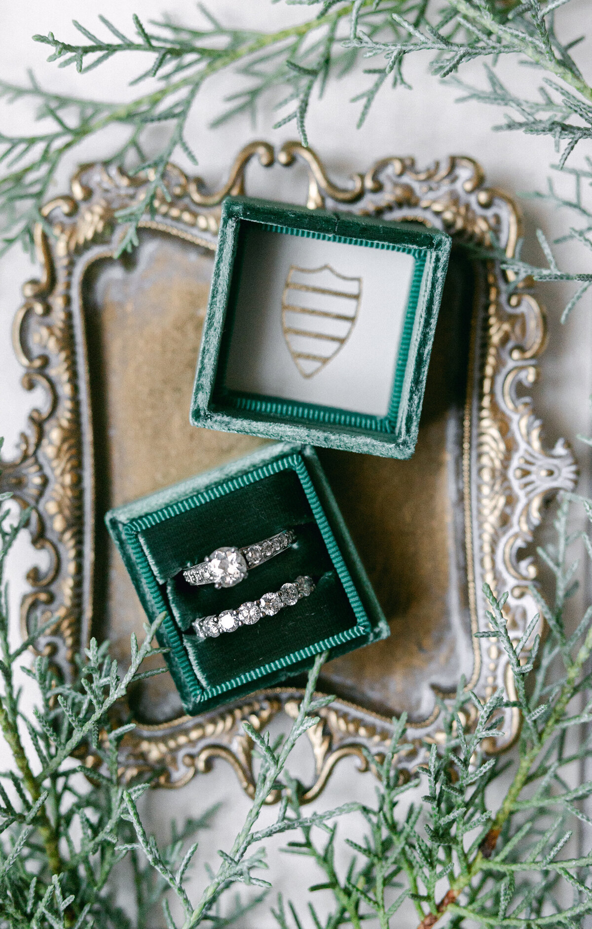 wedding rings in a teal box