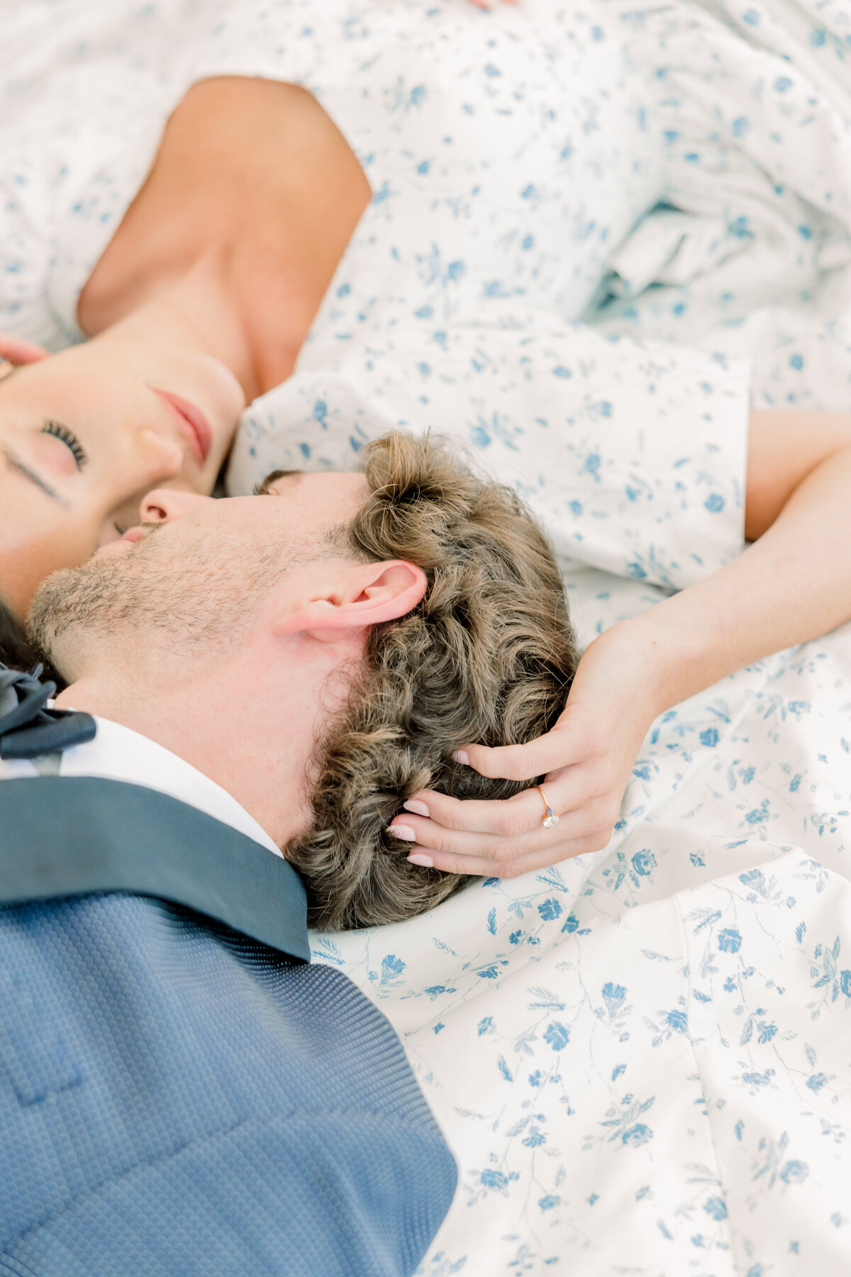 Bride and groom laying down together