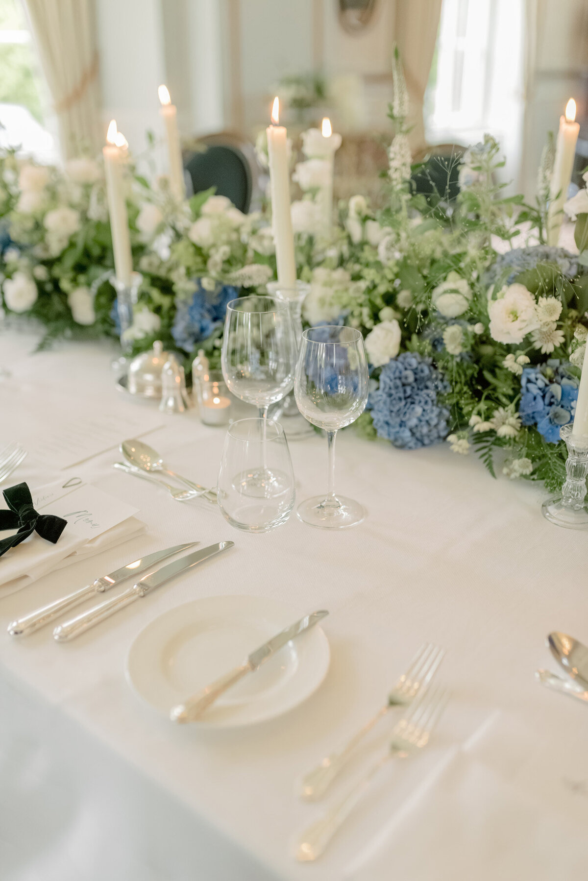 Wedding table with candles and flowers by Wild Burnett on a Gleneagles wedding day. Image by luxury wedding photographer Scotland, Jill Cherry Porter.