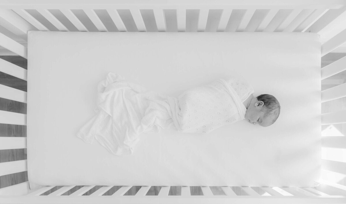 Lifestyle Bay Area newborn family photography in nursery with parents and baby.