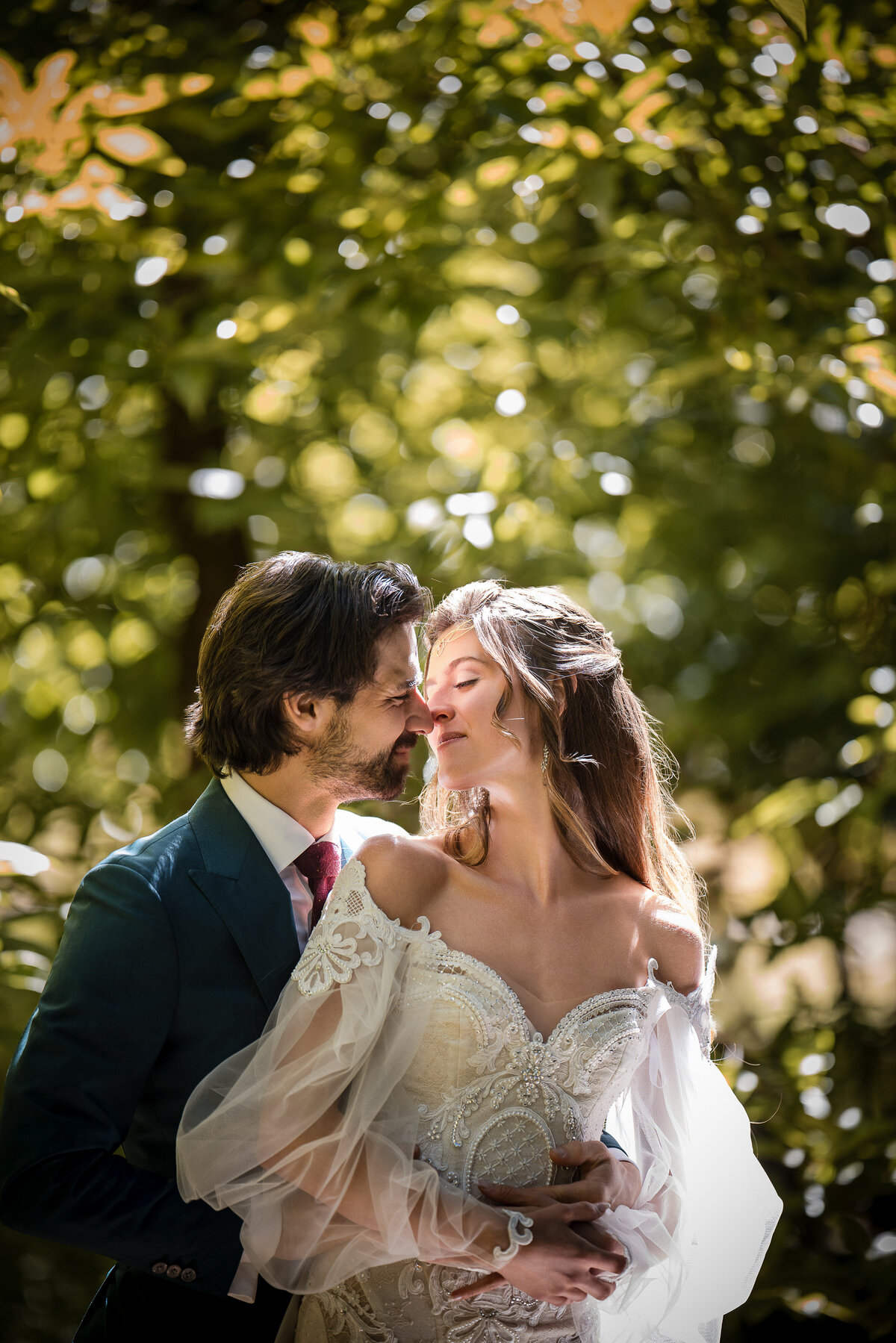 A couple poses at sunset at a destination wedding at Nestldown in Los Gatos, California