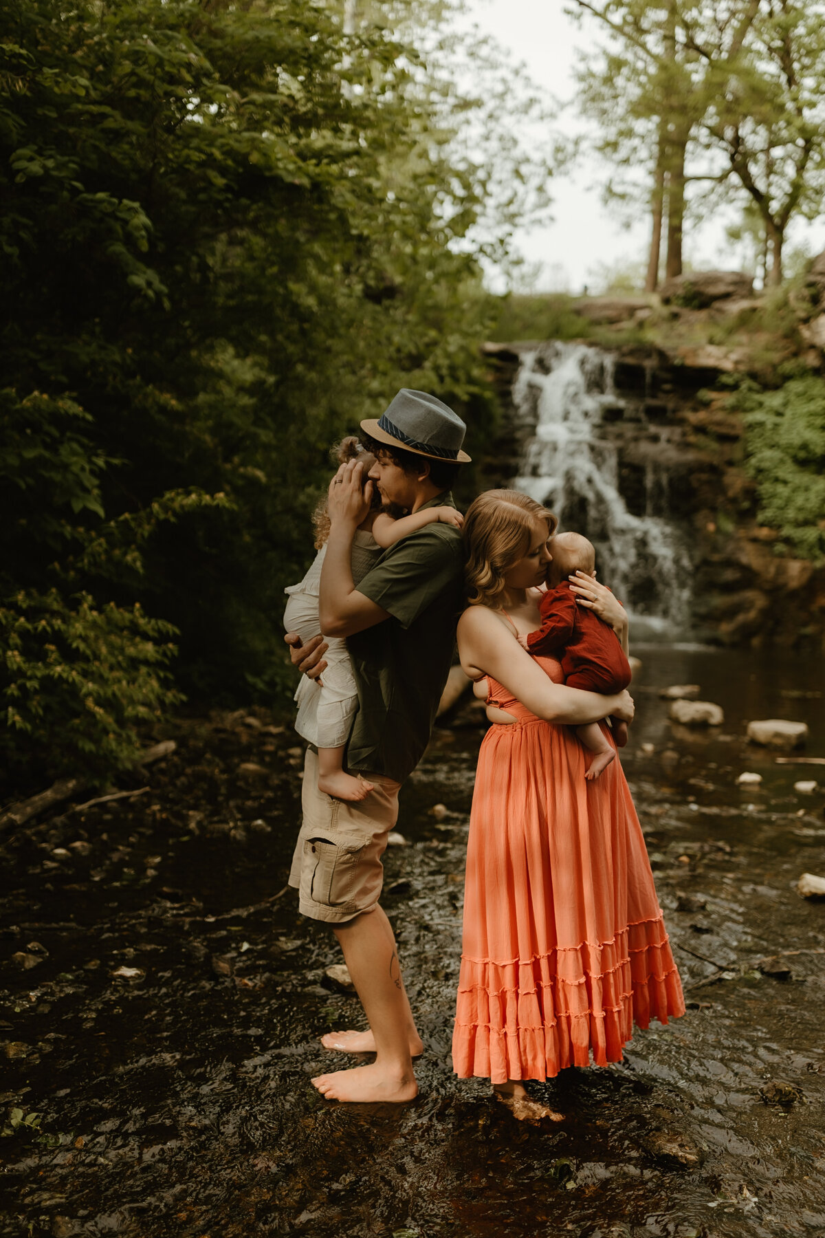 parents snuggling their babies during a family photoshoot