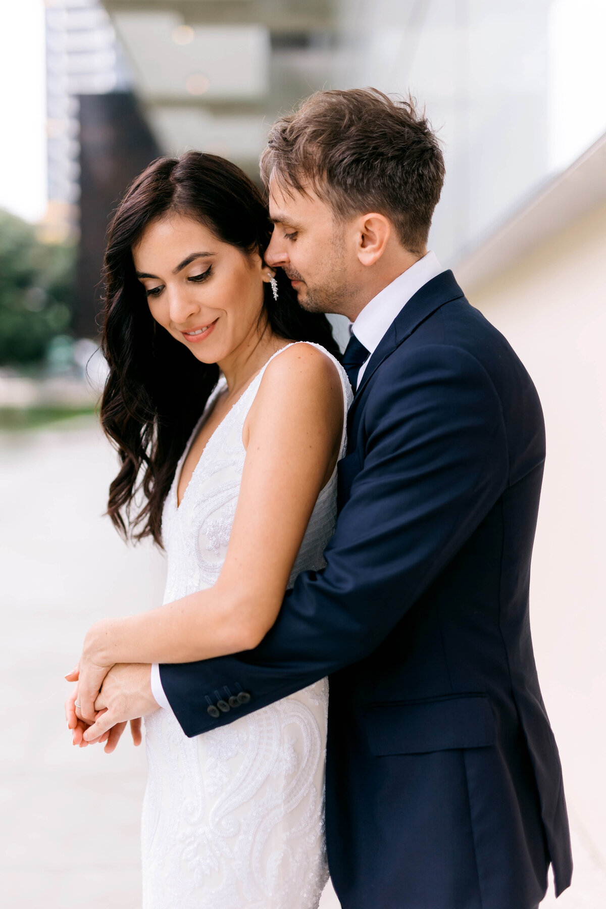 Candid portrait of a newly married couple outside GOMA South Bank after their Brisbane registry wedding — modern and romantic Brisbane wedding photography.
