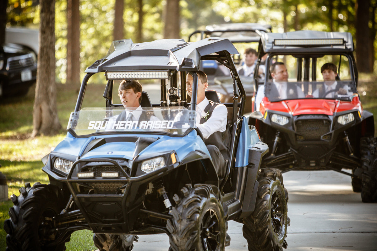 The groom and his groomsmen arrive at the ceremony in ATV's at the Citronelle Community Center in Citronelle, Alabama.