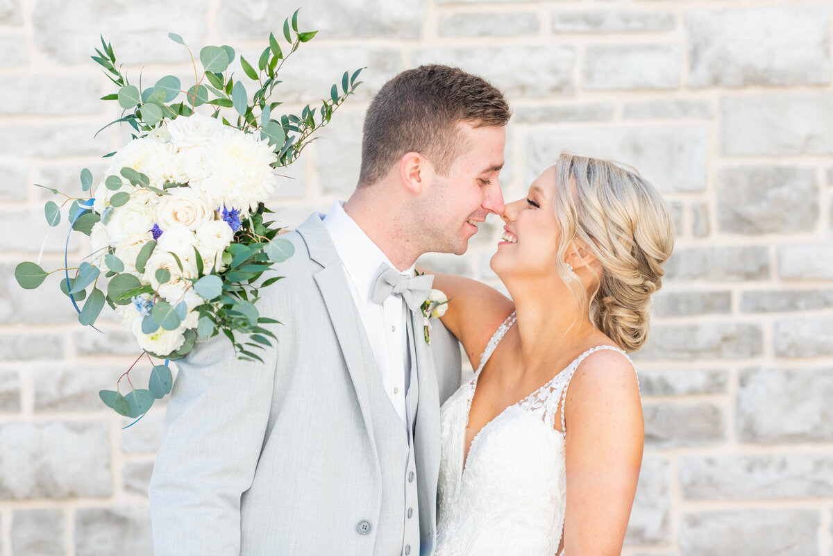 bride and groom touching noses