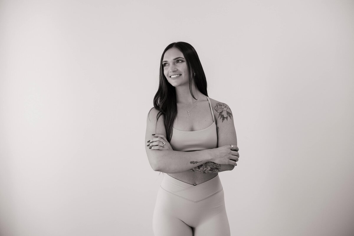 A functional health coach poses for a photo in a studio in Loveland, Colorado.