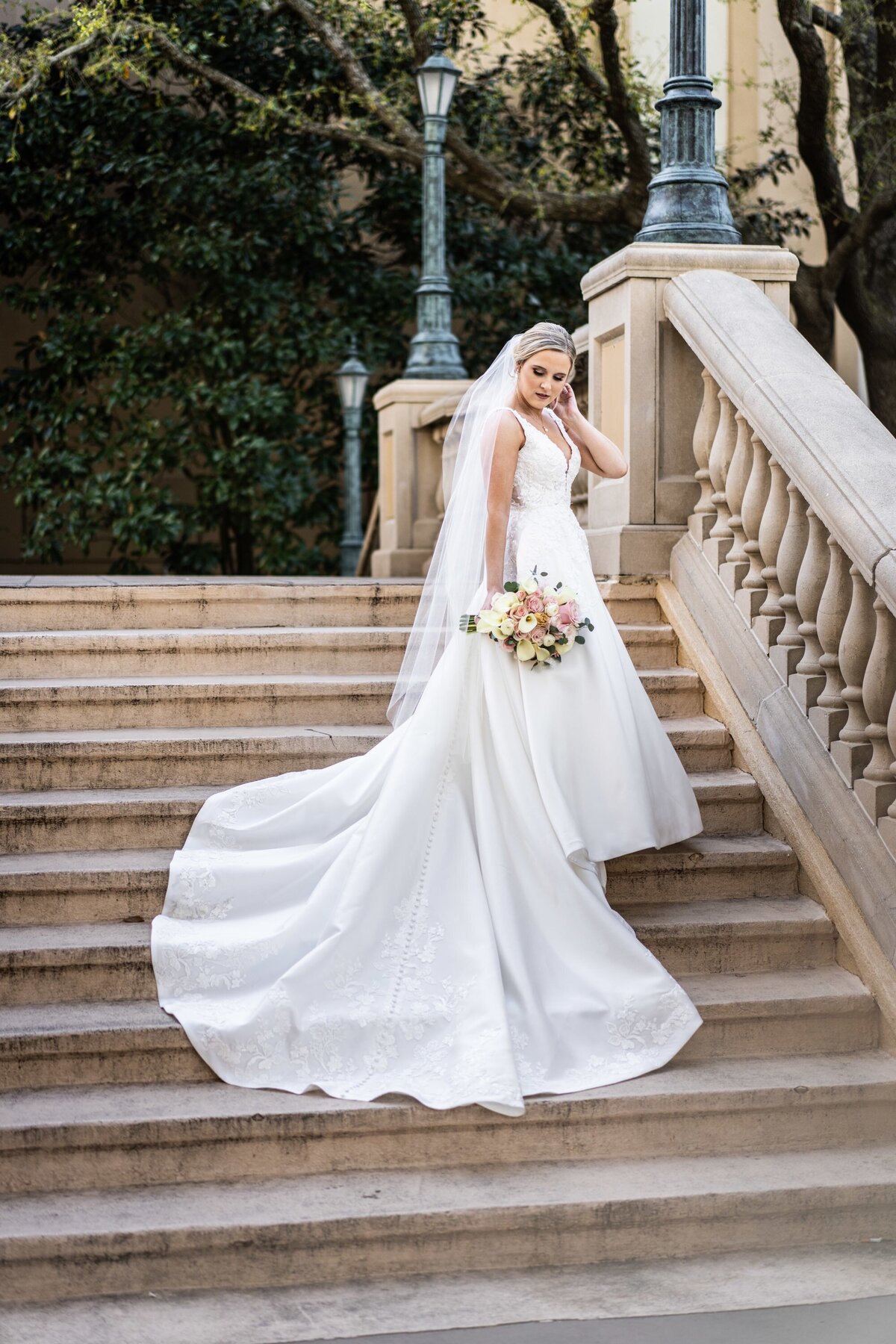 Bride on steps of Beau Rivage in Biloxi Mississippi
