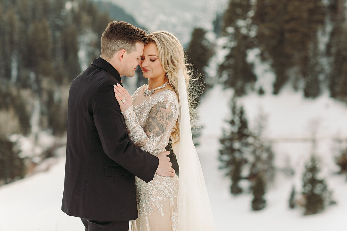 Utah Wedding Photographers capture couple hugging during mountain bridals at Park City wedding