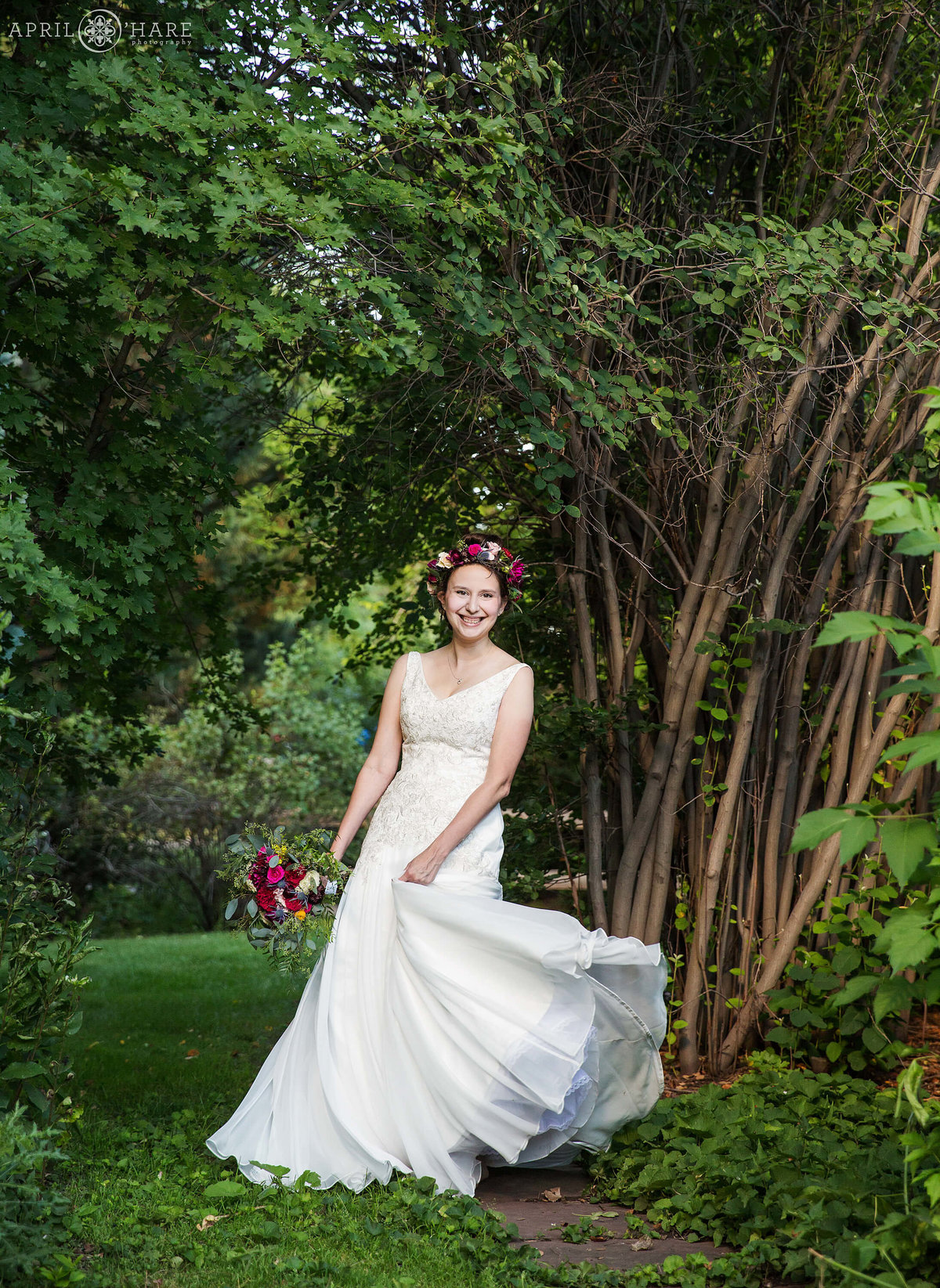 Bride dances in her wedding gown at Chatfield Farms in Colorado