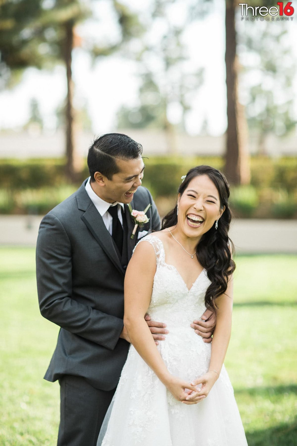 Bride and Groom share a laugh during the photo shoot
