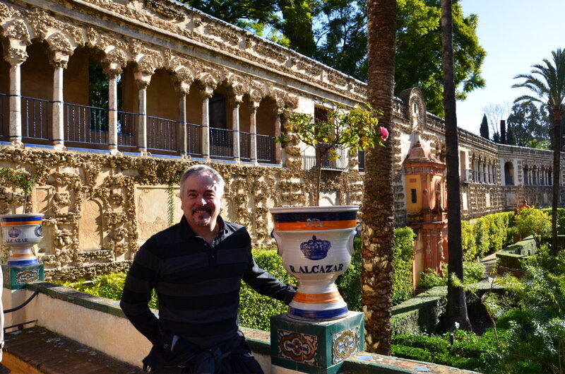 Tom Smith sitting in the Alcazar at Sevilla