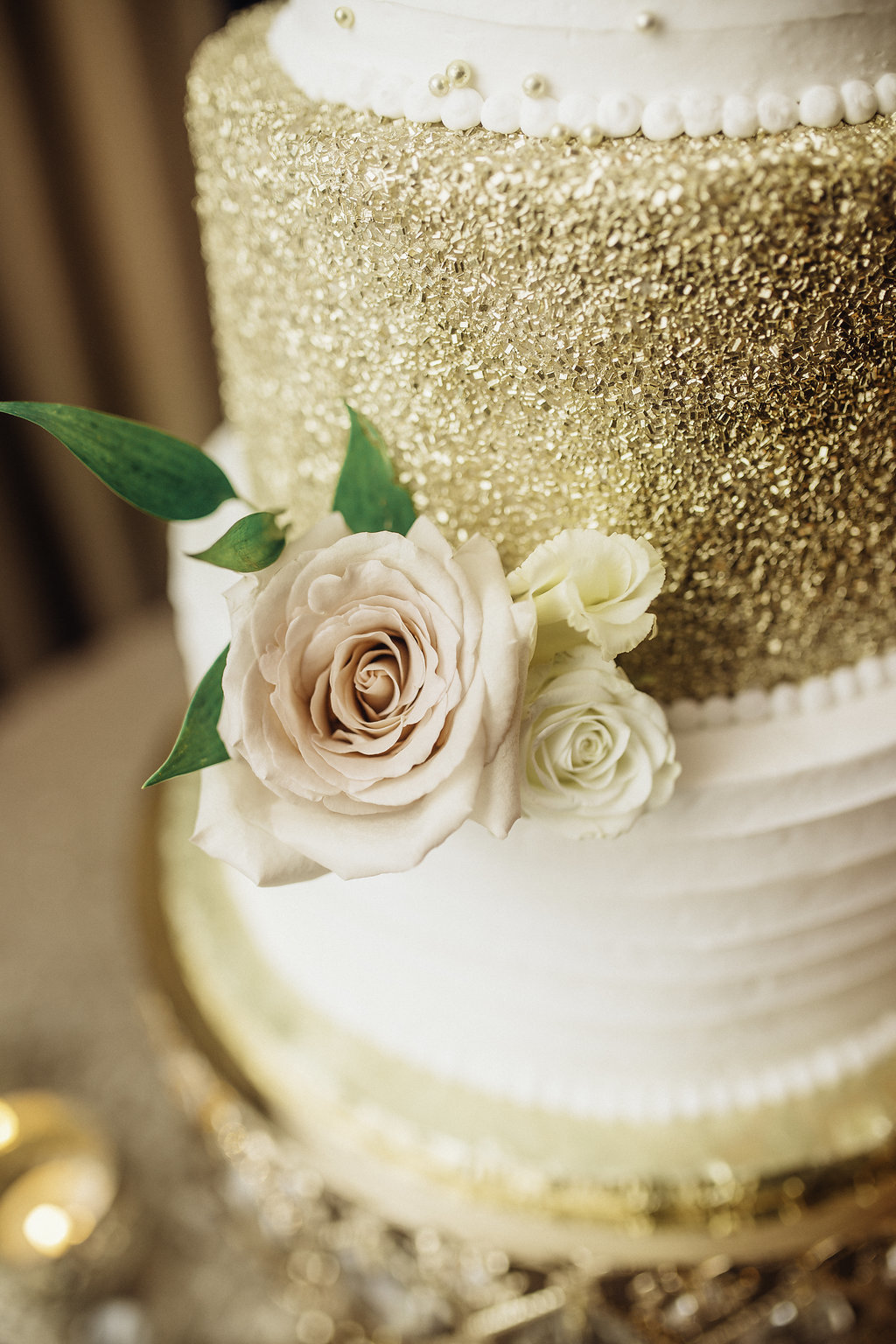 Wedding Photograph Of Cake Decorated With a Rose Los Angeles