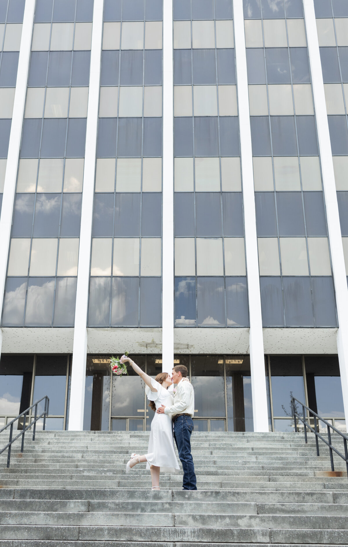 bride-and-groom-outside-Muscogee-County-Courthouse-Columbus-Georgia-Amanda-Richardson-Photography