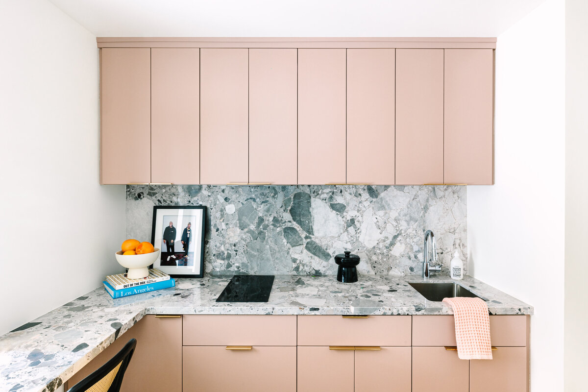 Mod Kitchenette with blush pink flat panel cabinets