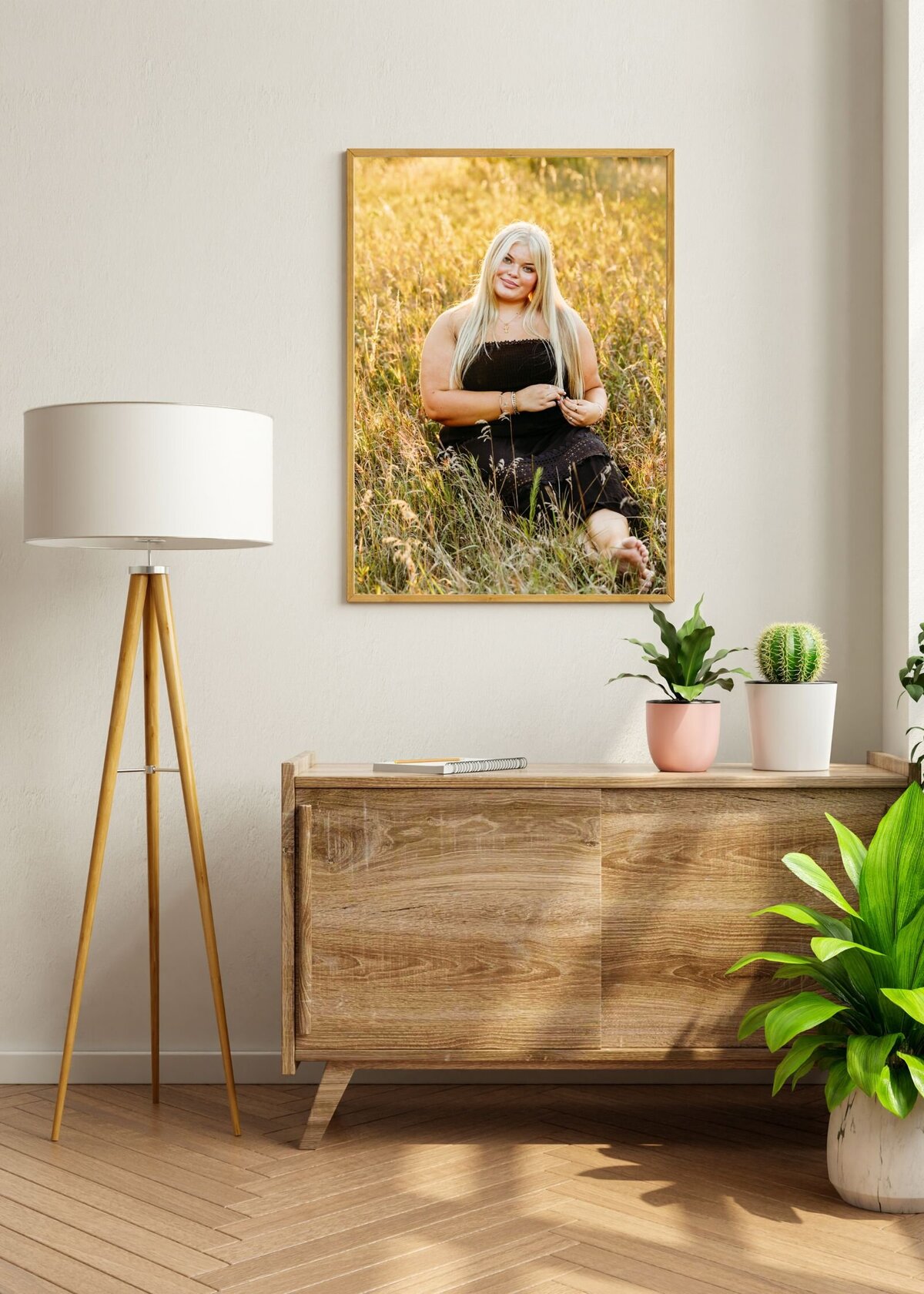 photo of a gorgeous senior girl's portrait hanging above a wooden buffet