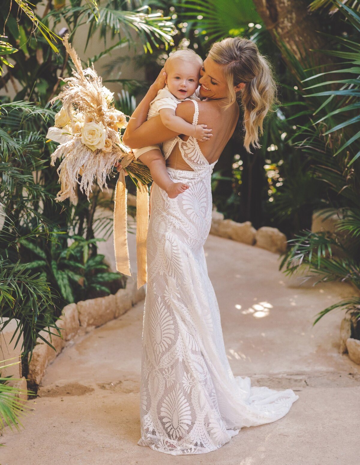 Bride hugging her baby boy at Vi