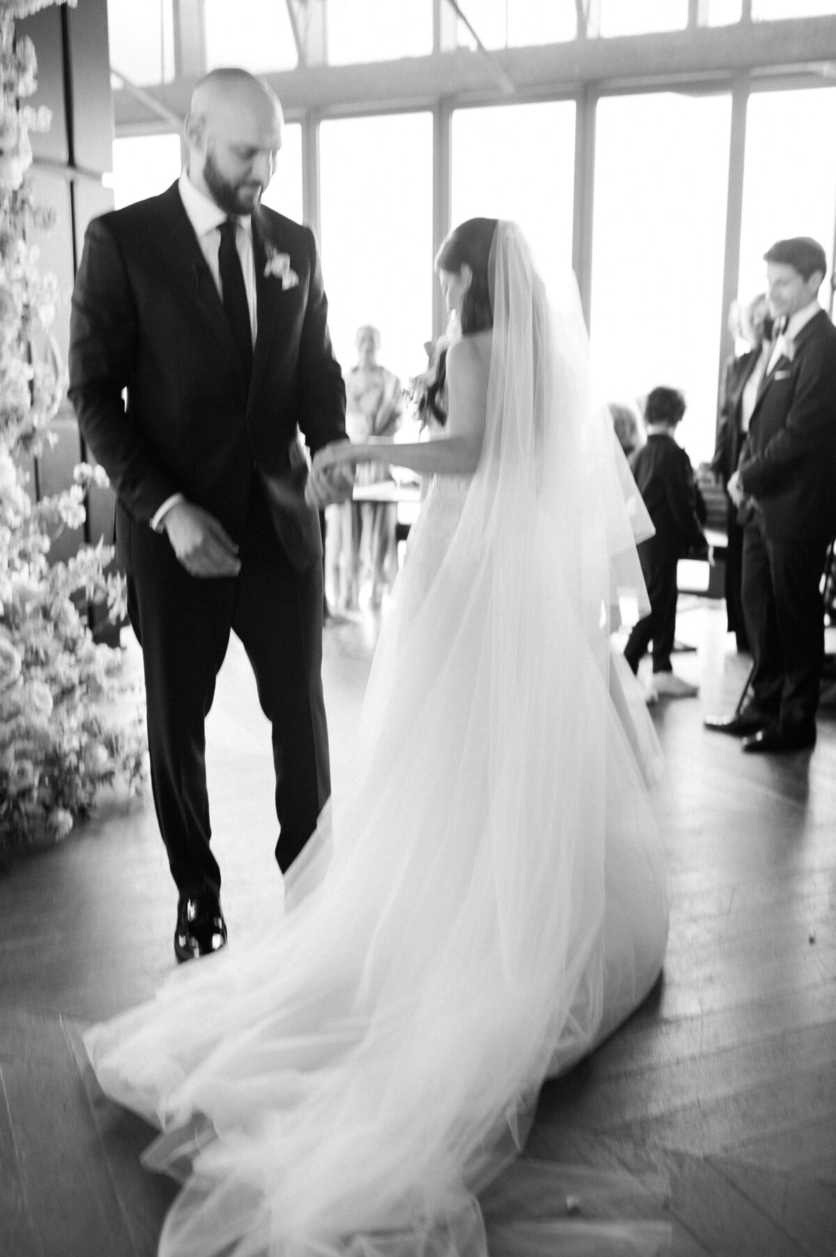 Bride and groom exchange places during their Jewish ceremony 