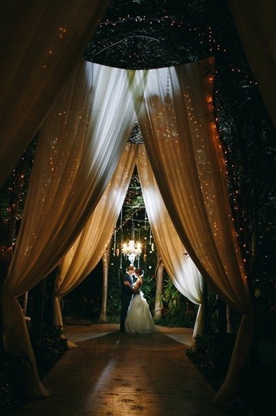 night time photos with bride and groom with curtain detail