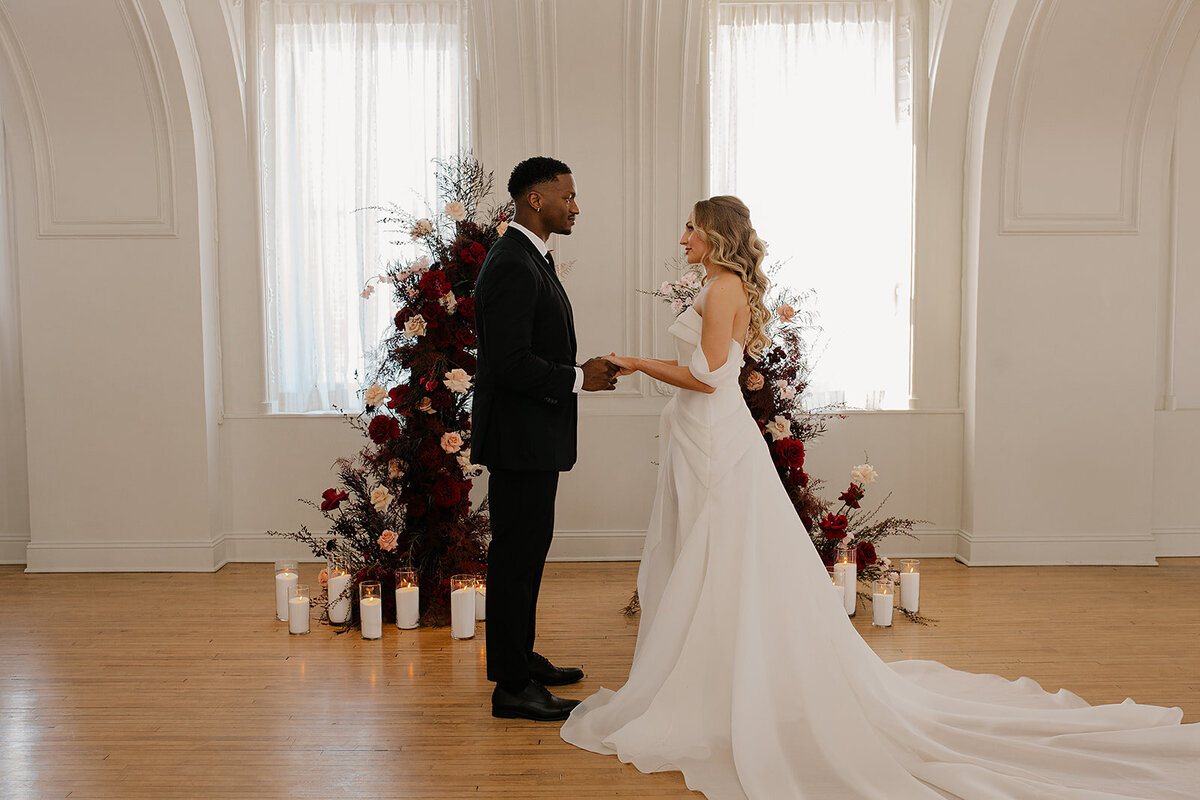 "Bride and groom celebrate their elegant luxury wedding at the historic Cottonwood Hotel in Omaha, NE – timeless moments captured by Tori Nichole Photography. A perfect blend of sophistication, romance, and architectural charm, showcasing the couple's love story in an unforgettable setting.