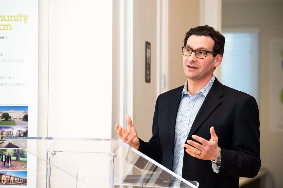the host of eQ addressing and welcoming guests to the eQ Groundbreaking event.  Captured by Ottawa Event Photographer JEMMAN Photography COMMERCIAL