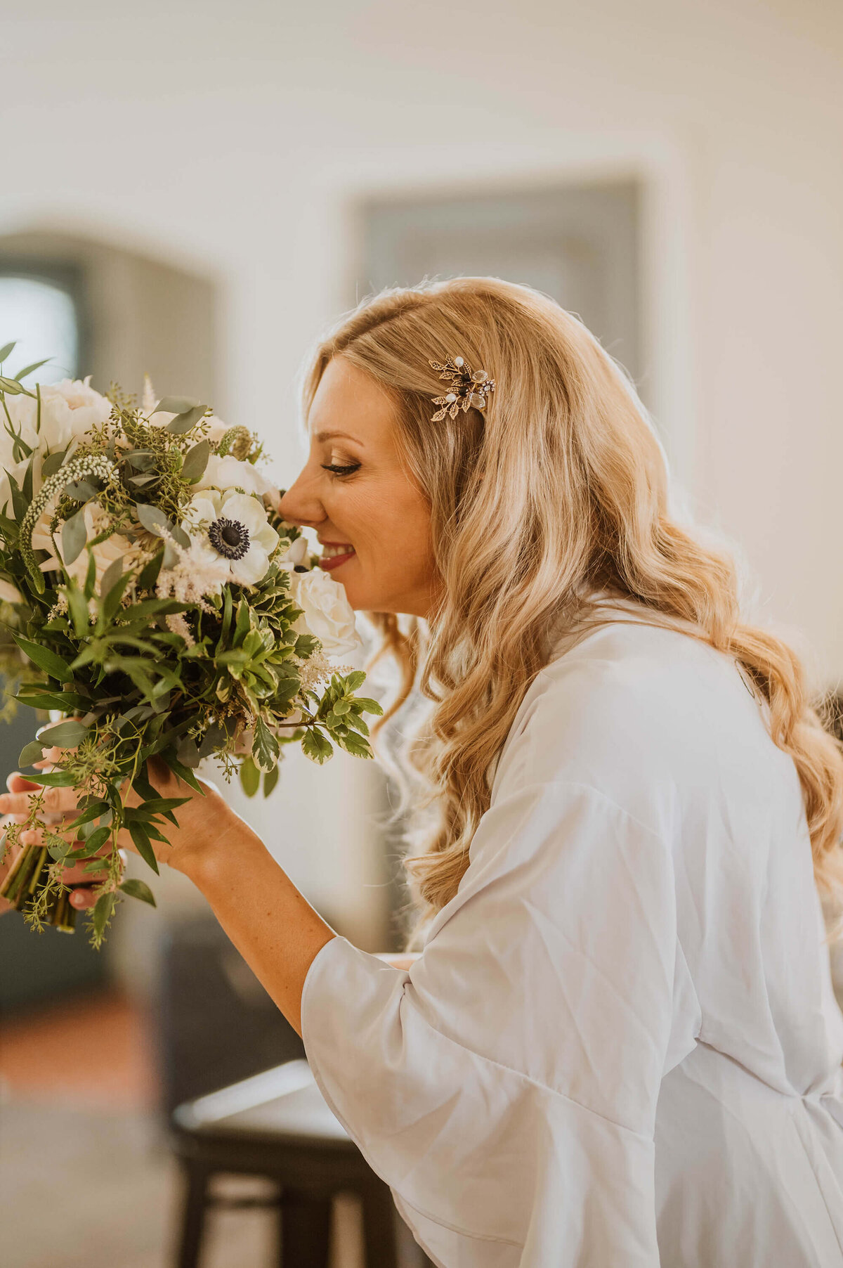 A bride smelling her bridal bouquet in Tahoe.