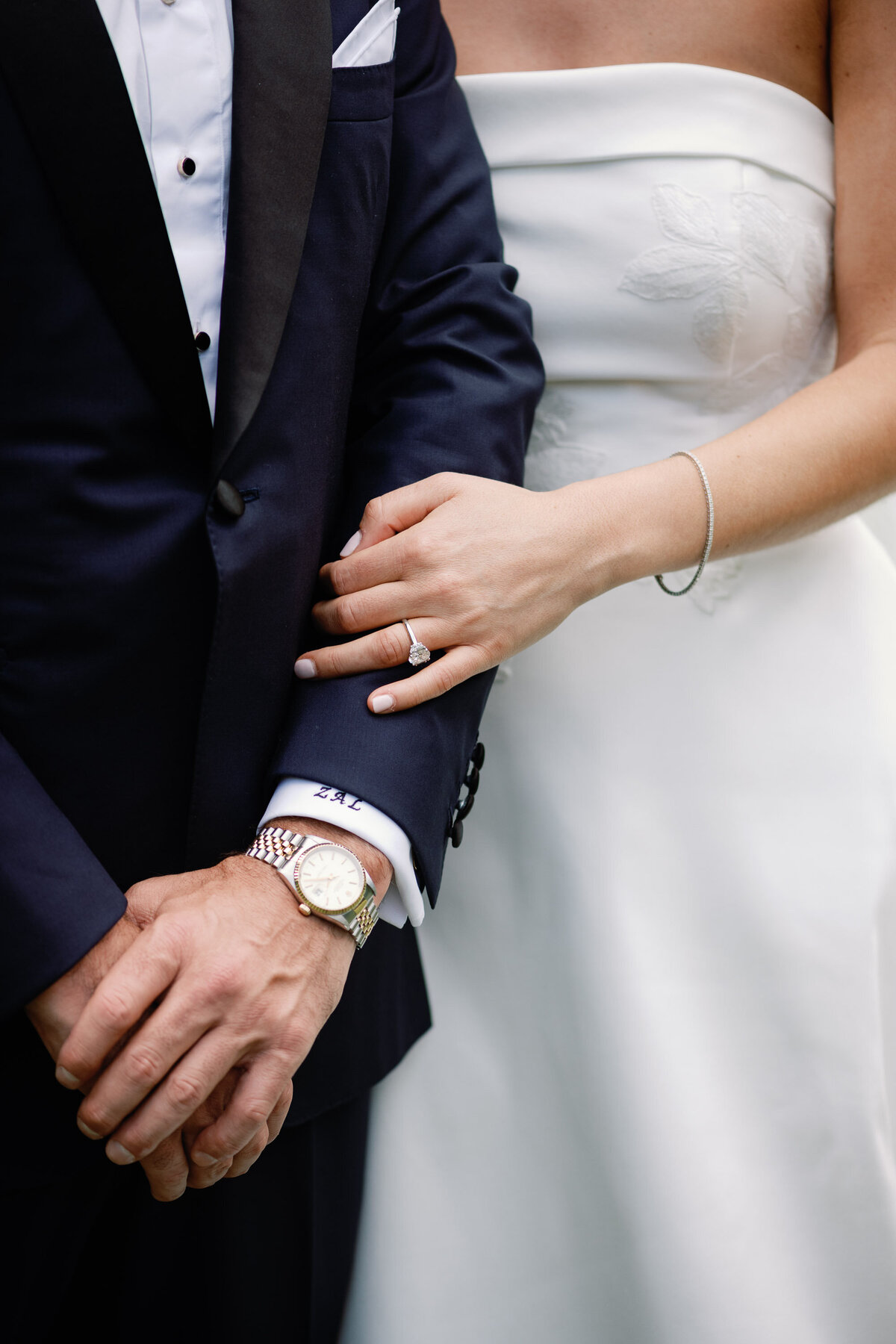 bride and groom hold hands at wedding in vermont