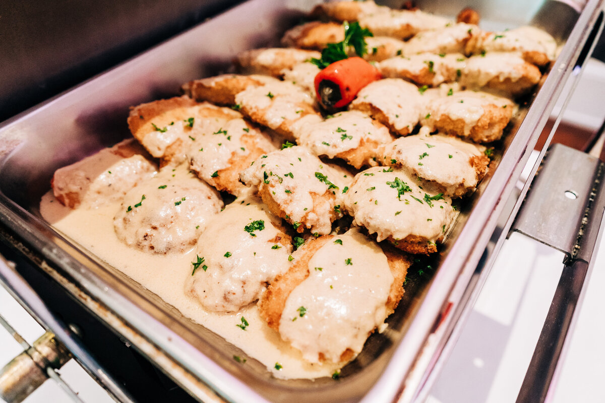 Deviled Chicken marinated in spicy mustard & cayenne, coated & baked in a panko crust with Dijon white wine sauce