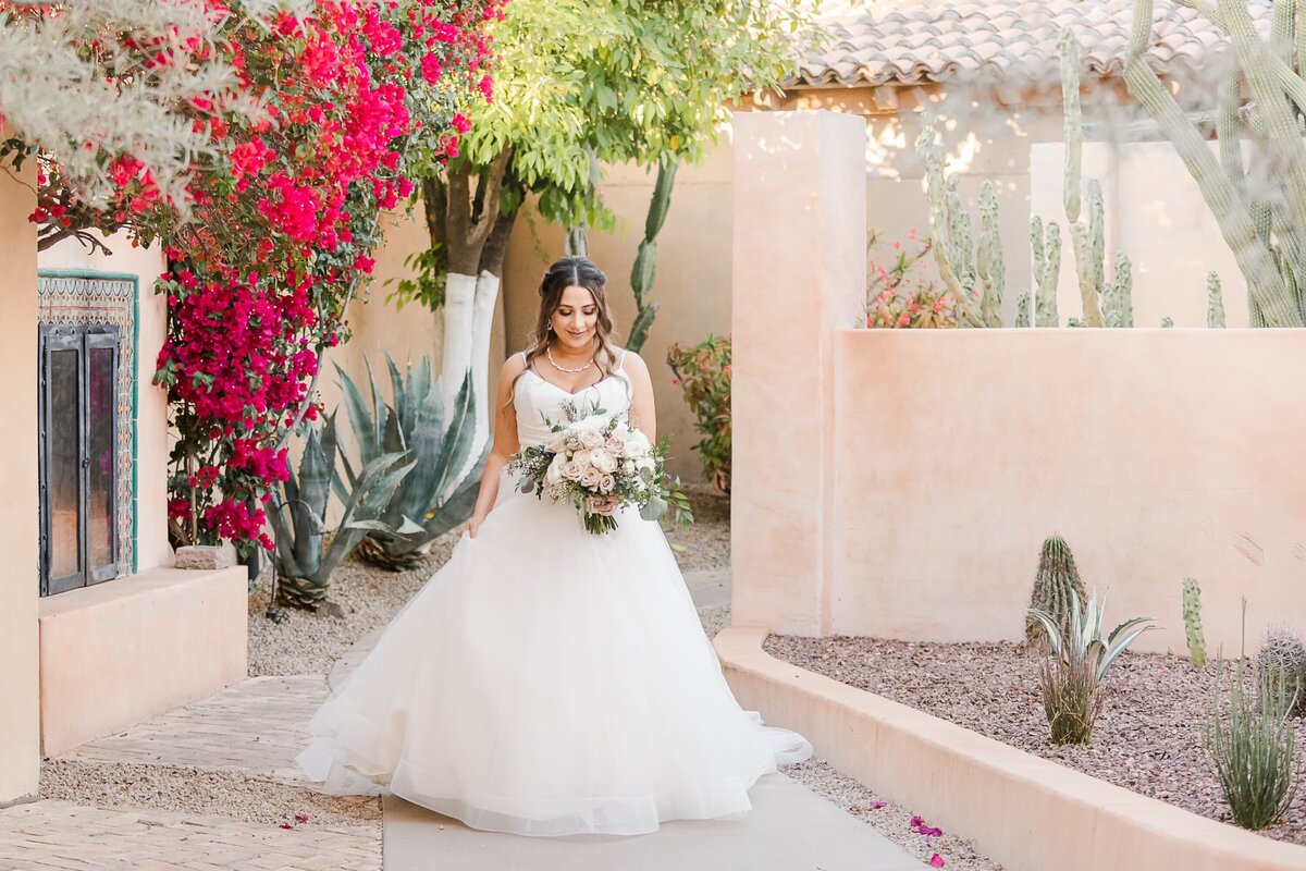 Scottsdale-Wedding-Photographers-Royal-Palms-Bride-Walking-1402