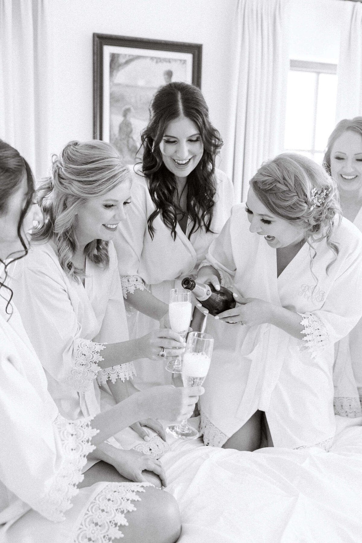 Bridal party makes a toast at spring wedding in central Texas
